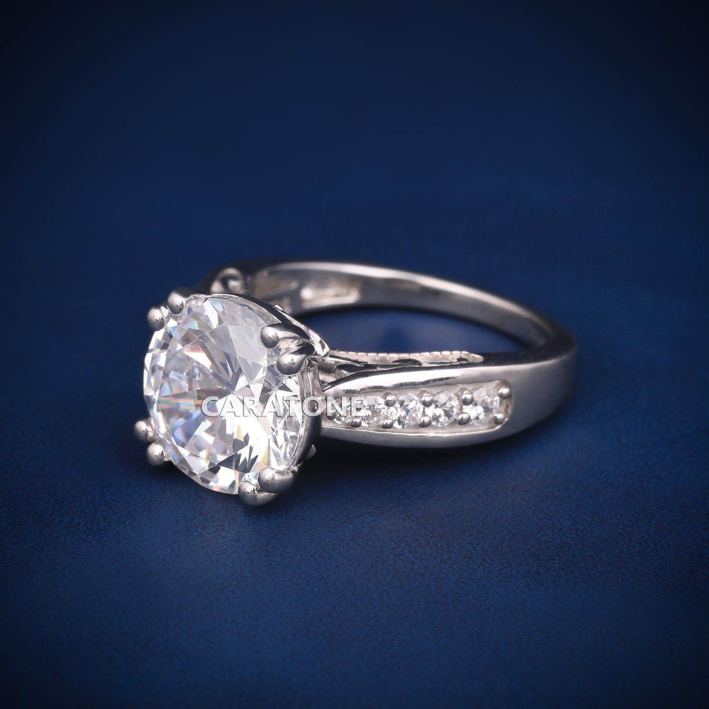 Round cut engagement ring with diamond tester passed