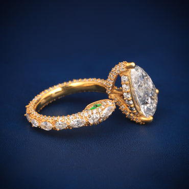 Pear and solitaire diamond wedding ring with diamond tester passed