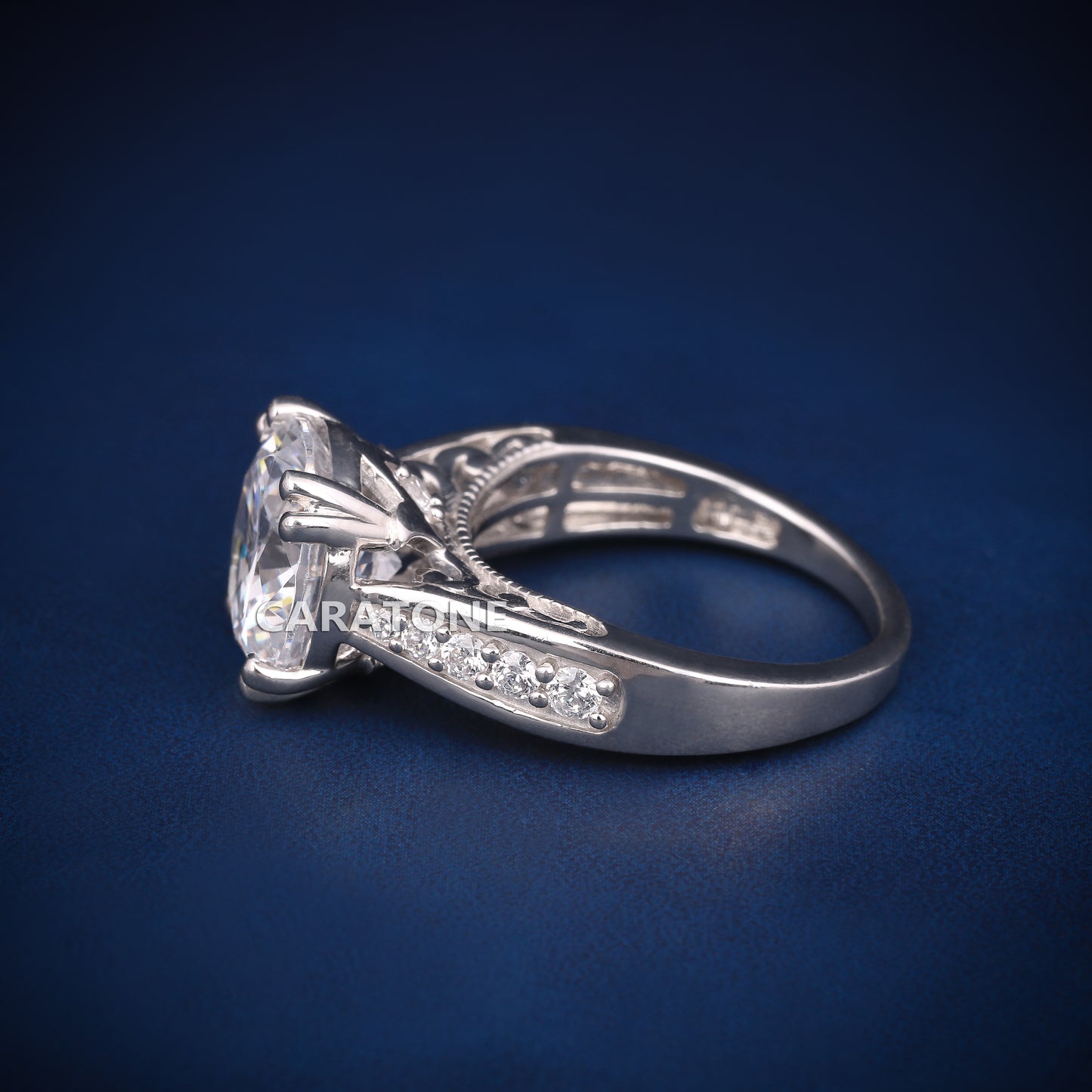 Round cut engagement ring with diamond tester passed