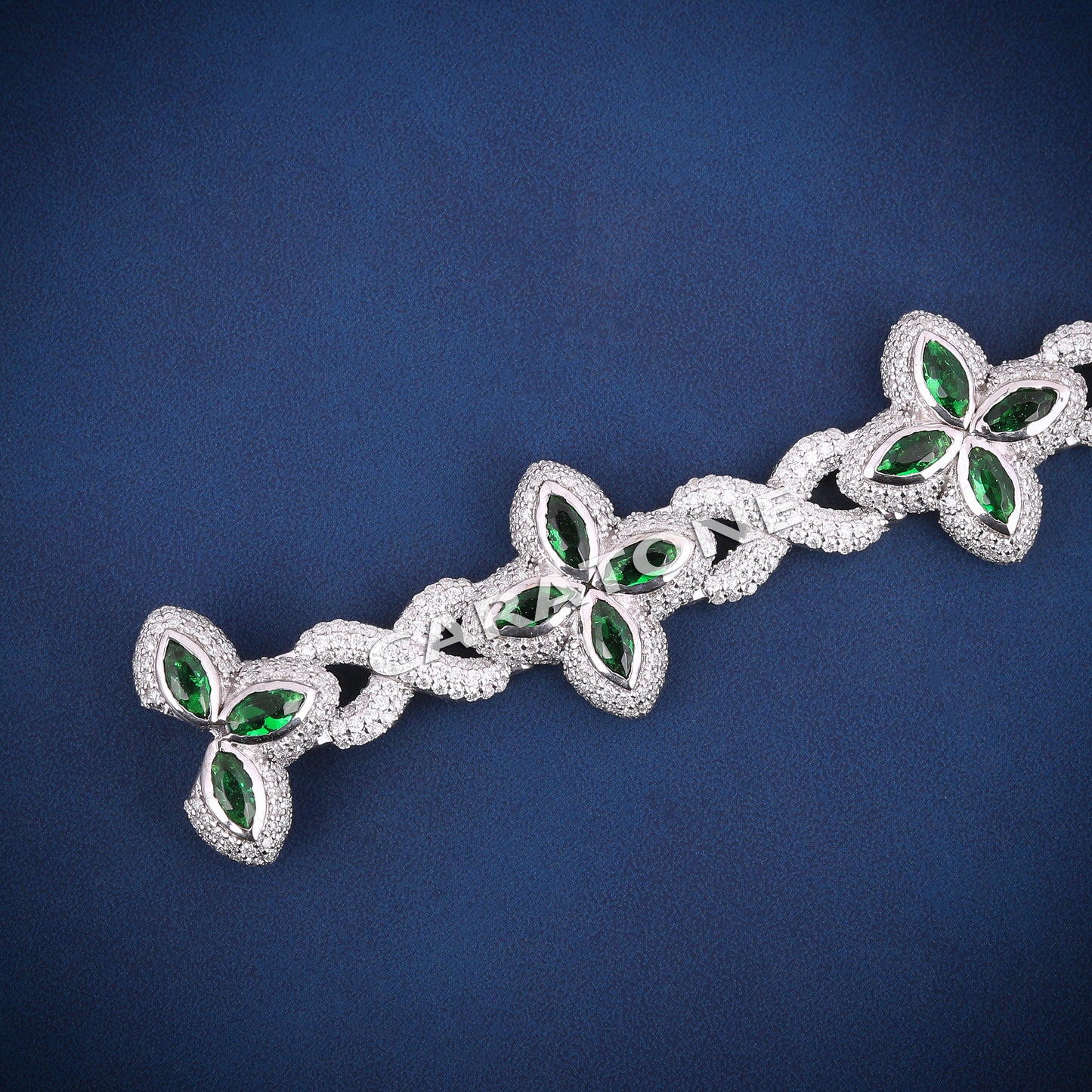Infinity style green gemstone diamond clover bracelet