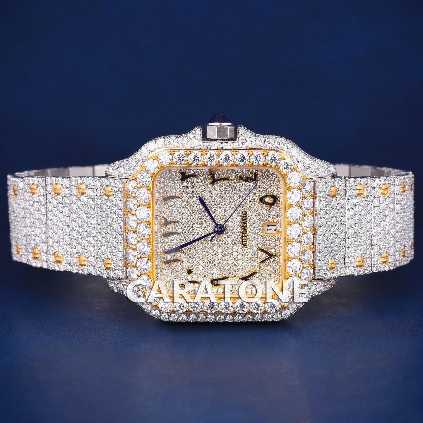 Full iced out hip hop branded watch in two tone with black arabic numerals in dial and it is of D VVS clarity