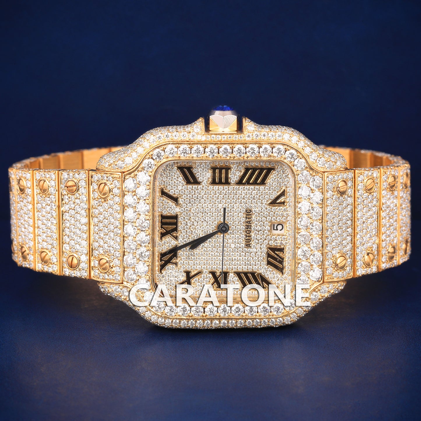 Hip hop full iced out branded watch in gold tone with black roman numerals in it