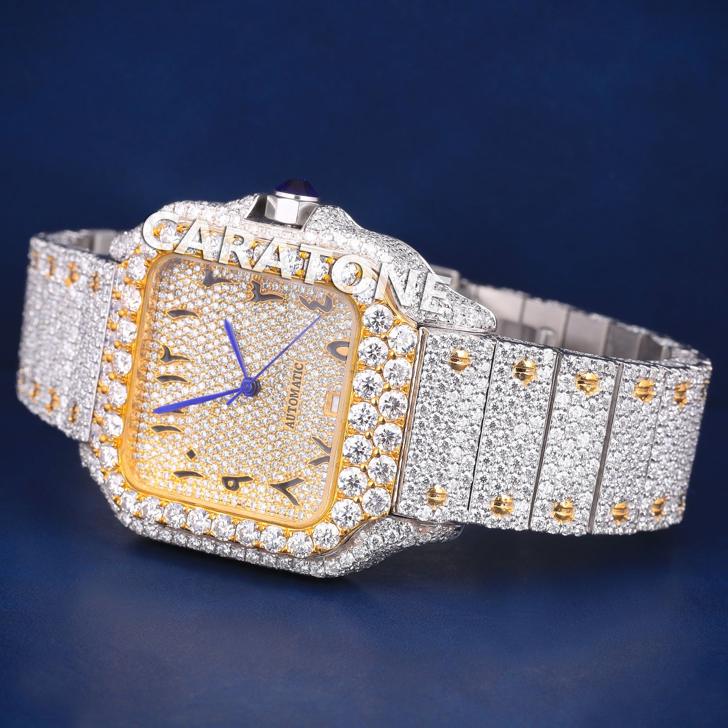 Full iced out hip hop branded watch in two tone with black arabic numerals in dial and it is of D VVS clarity