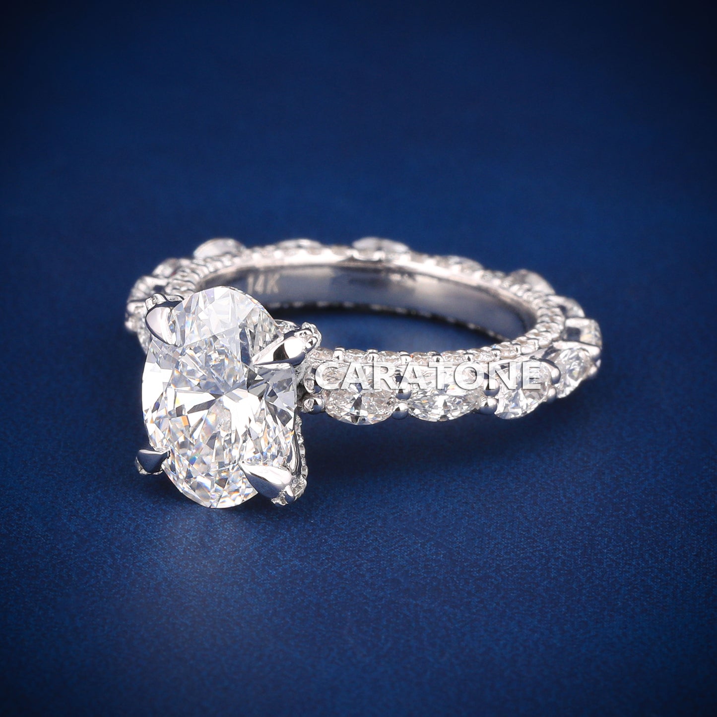 Oval cut diamond engagement ring in white gold with full halo and side stones