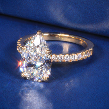 Exclusive Premium Pear Cut Solitaire Ring With Brilliant White Center Stone, Sparkling Pave Set Side Stones, Elegant Yellow Gold Tone Band And Unique Luxury Designer Engagement Jewelry For Women