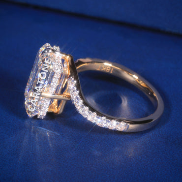 Elegant Yellow Gold Diamond Engagement Ring with a Stunning Emerald-Cut Center Stone and Brilliant Diamond-Studded Band