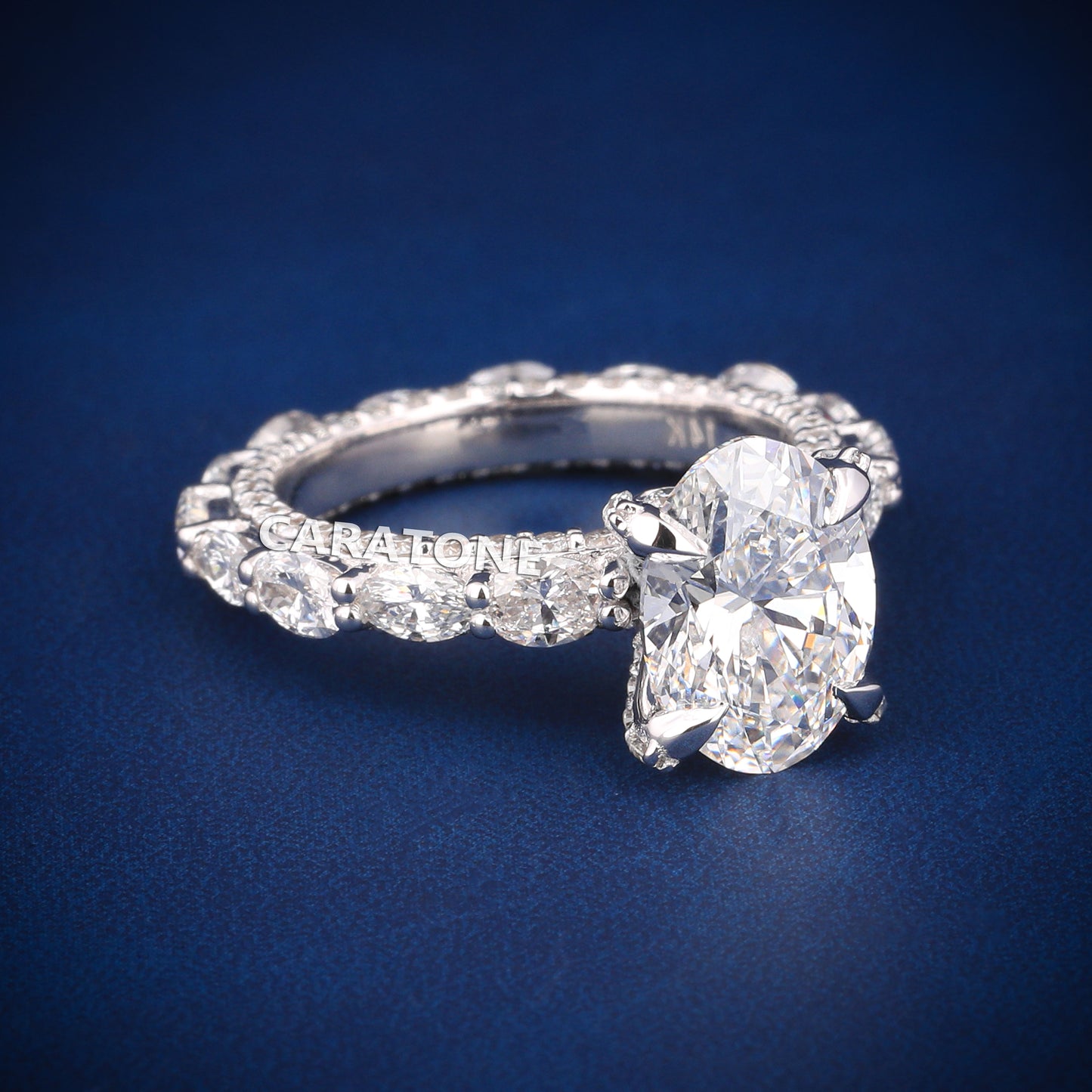 Oval cut diamond engagement ring in white gold with full halo and side stones