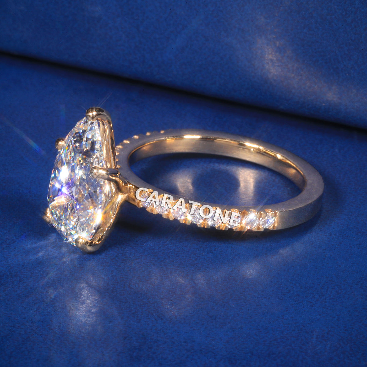 Exclusive Premium Pear Cut Solitaire Ring With Brilliant White Center Stone, Sparkling Pave Set Side Stones, Elegant Yellow Gold Tone Band And Unique Luxury Designer Engagement Jewelry For Women
