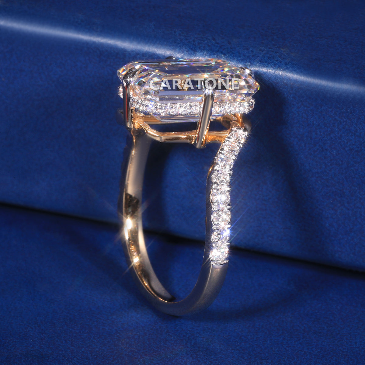 Elegant Yellow Gold Diamond Engagement Ring with a Stunning Emerald-Cut Center Stone and Brilliant Diamond-Studded Band