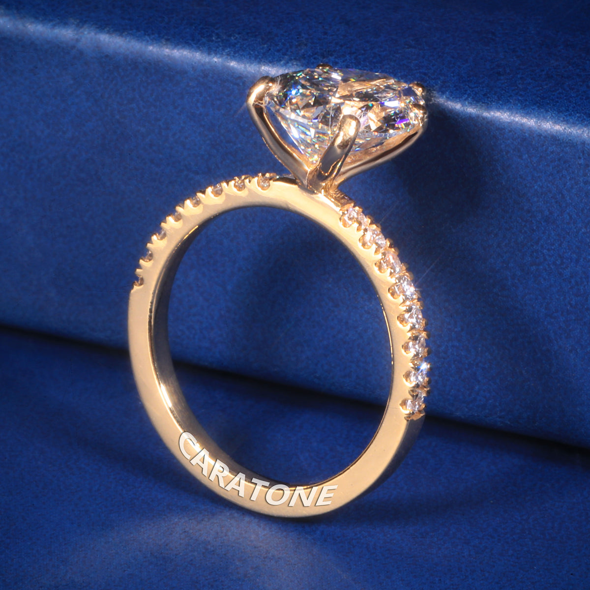 Exclusive Premium Pear Cut Solitaire Ring With Brilliant White Center Stone, Sparkling Pave Set Side Stones, Elegant Yellow Gold Tone Band And Unique Luxury Designer Engagement Jewelry For Women