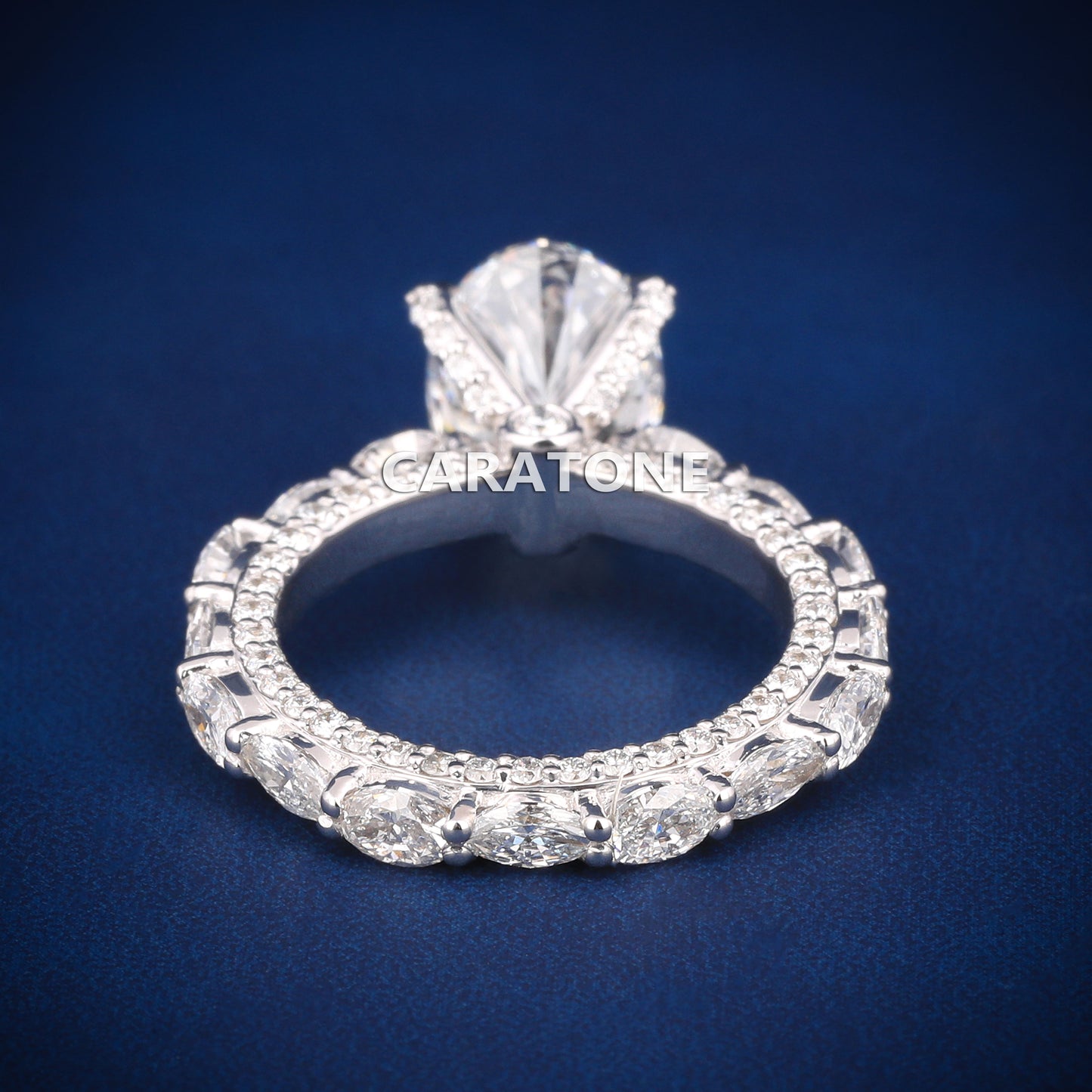 Oval cut diamond engagement ring in white gold with full halo and side stones