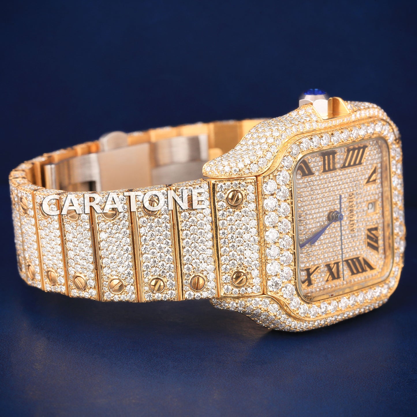 Hip hop full iced out branded watch in gold tone with black roman numerals in it