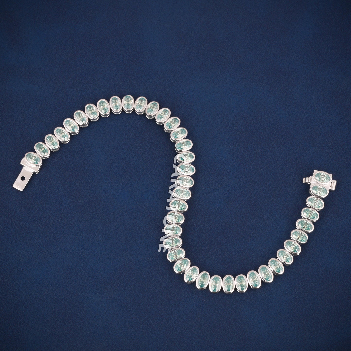 Luxury White Gold Tennis Bracelet with Oval Cut Green Stones for Womens Elegant Style