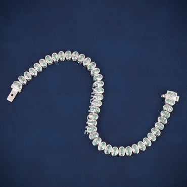 Luxury White Gold Tennis Bracelet with Oval Cut Green Stones for Womens Elegant Style