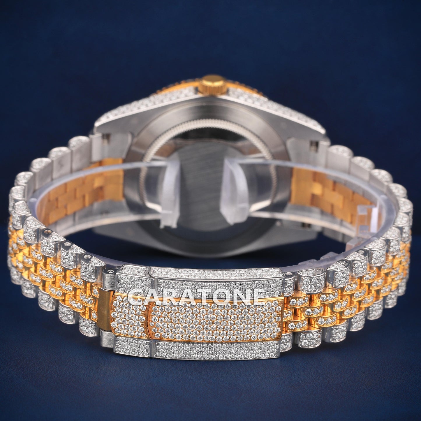 Full iced out Hip hop branded watch in two tone with Arabic numerals and Diamond tester passed